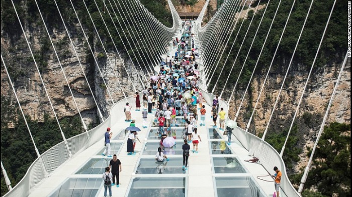China`s record-breaking glass bridge closes due to `overwhelming demand` China`s record-breaking glass bridge closes due to `overwhelming demand`
